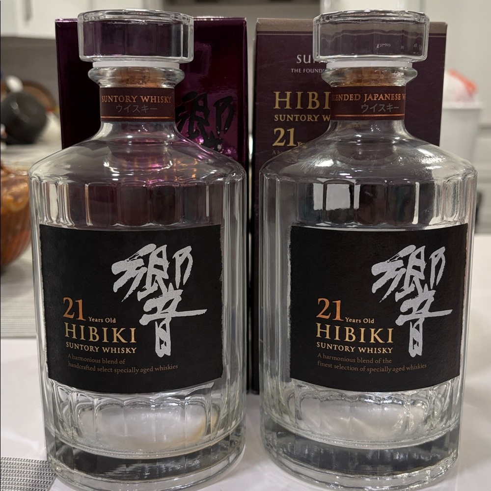 2 empty bottles of suntory whisky hibiki 21 years old Japanese whisky